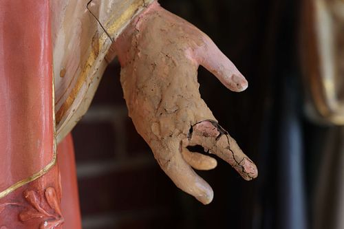 Badly broken hand on the Sacred Heart statue from the backside