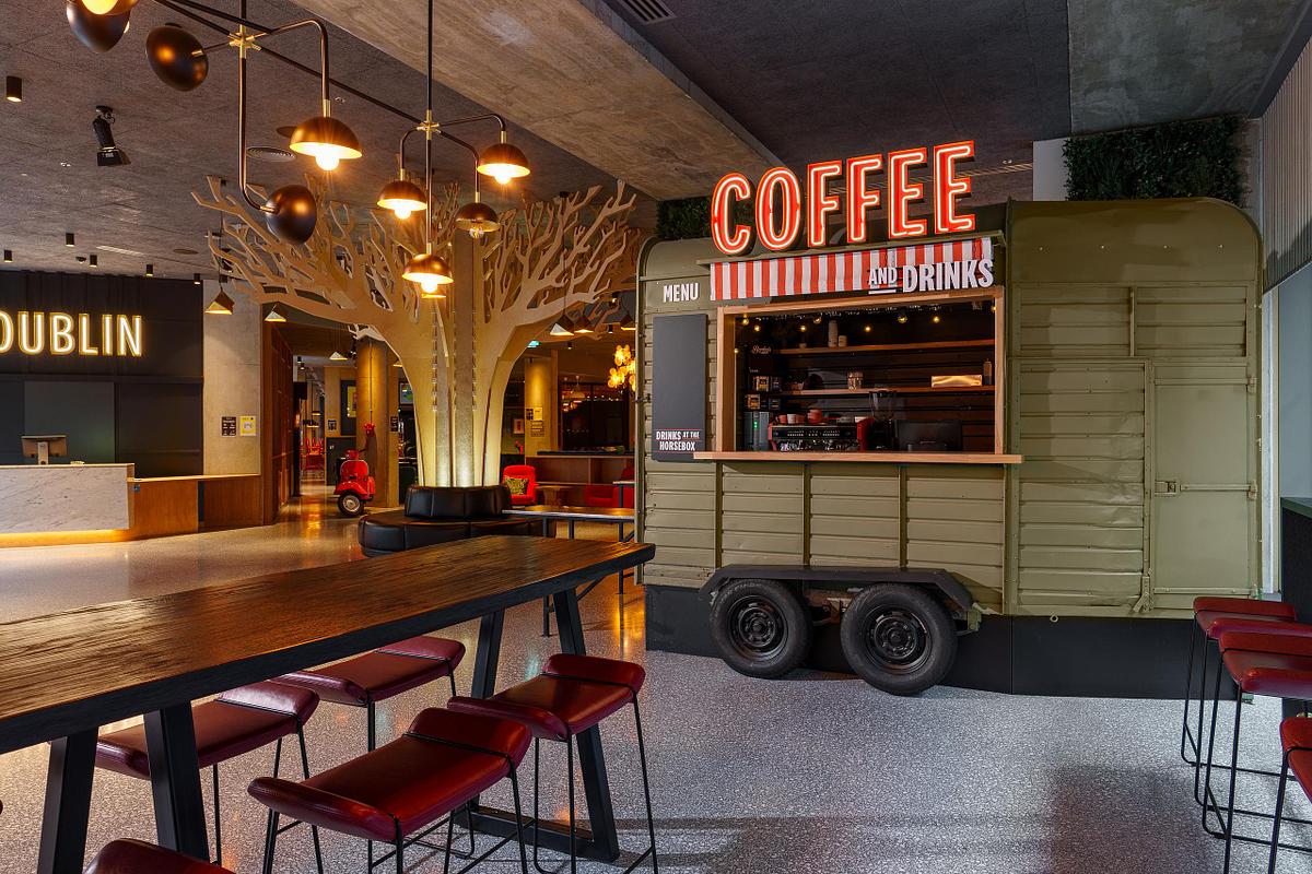 Interior photograph of the Marlin Hotel Dublin, featuring a unique coffee and drinks kiosk made from a repurposed horsebox