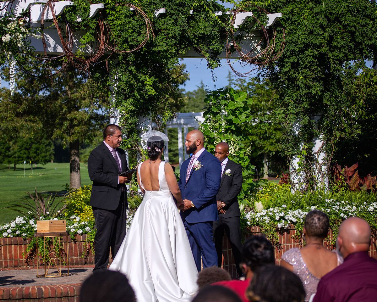 baywood wedding ceremony under the flower covered gazebo