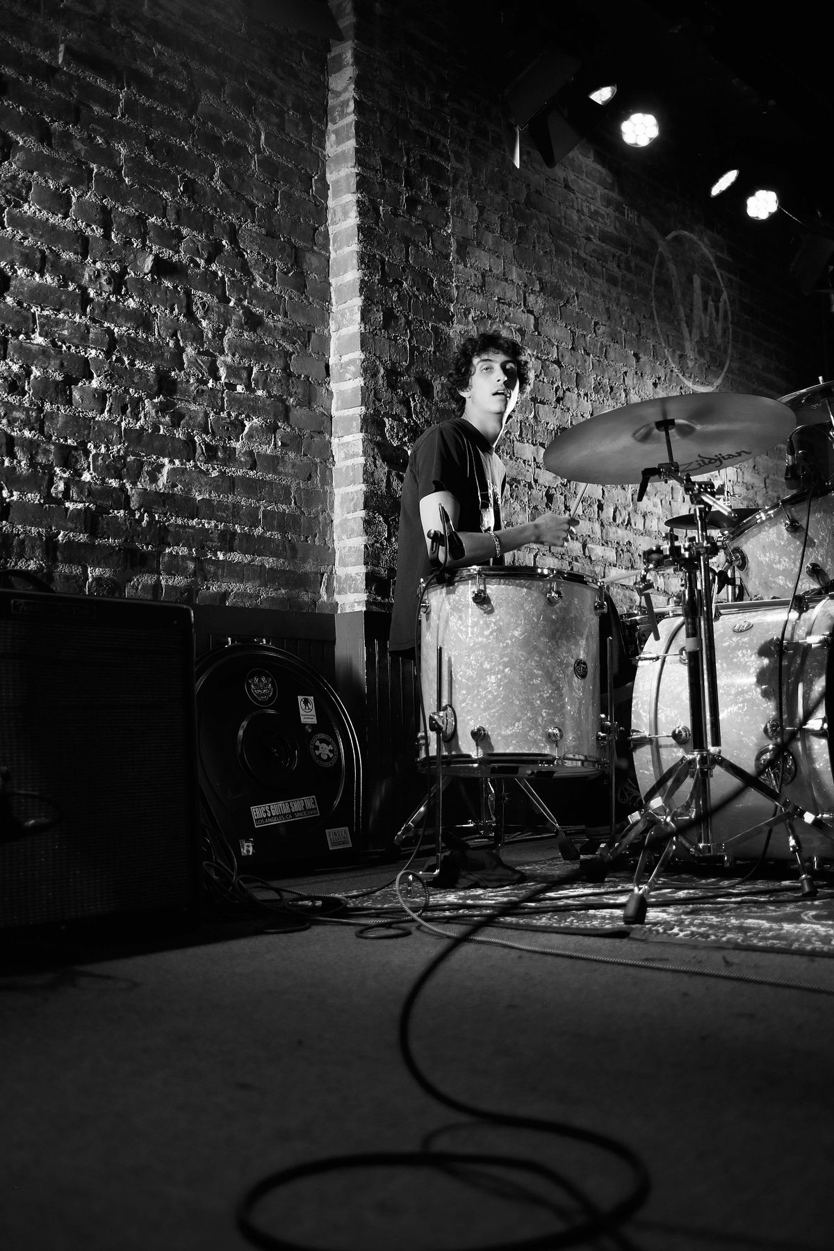 Black & white photo of a drummer performing at The Venice West in Venice, California