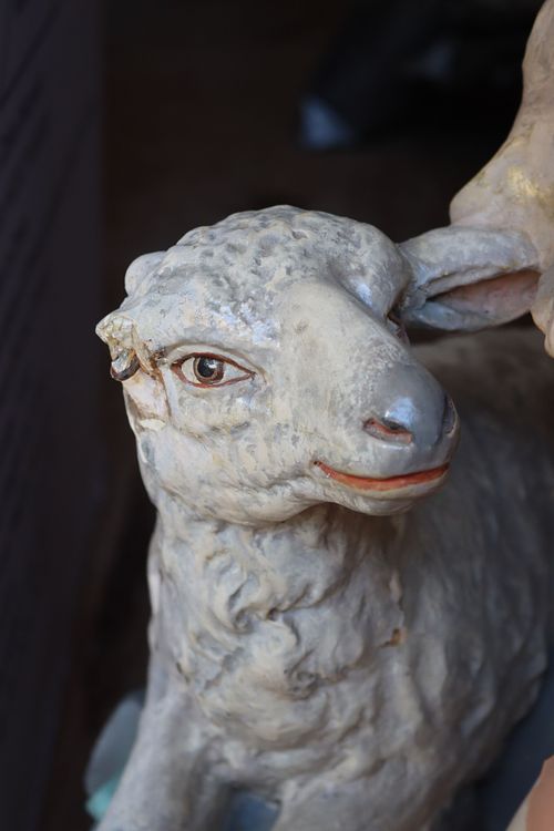 antique plaster statue lamb with broken ear
