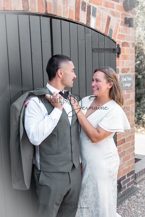 Bride-and-groom-listening-to-officiant-at-Oakham-Registry-Office