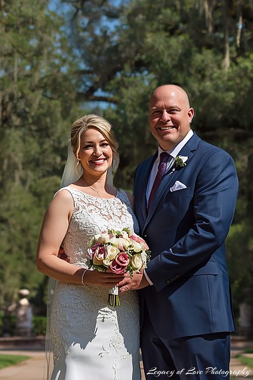 A mature bride and groom sharing an intimate moment during their second marriage ceremony in a beautiful natural outdoor setting in North Florida.