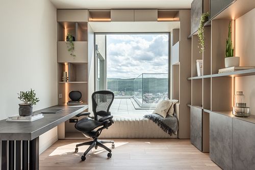 Office space bathed in warm light with a large window &ndash; Scala project