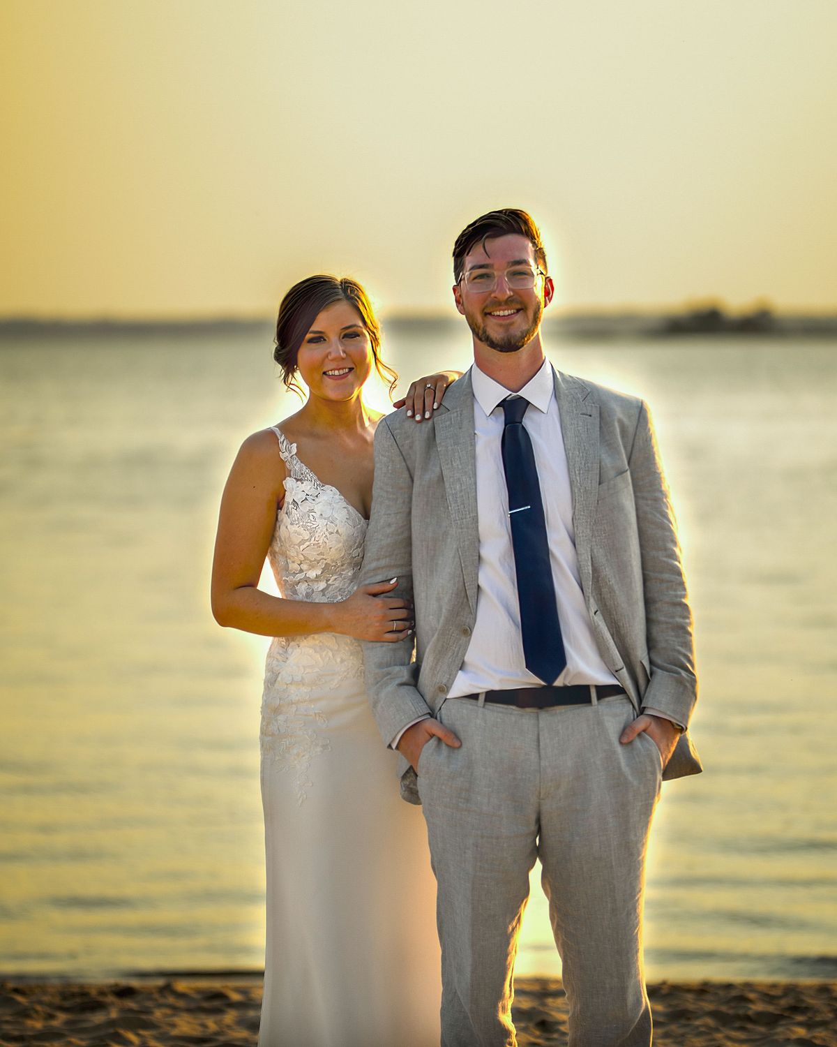 bride and groom posing at the beach at the hyatt in dewey beach, Delaware