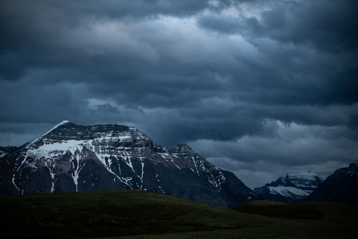 Moody skies over a mountain range in Waterton Lakes National Park