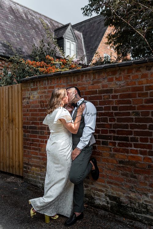 Bride-and-groom-listening-to-officiant-at-Oakham-Registry-Office