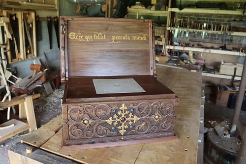 step one of setting up for Mass: opening the lid