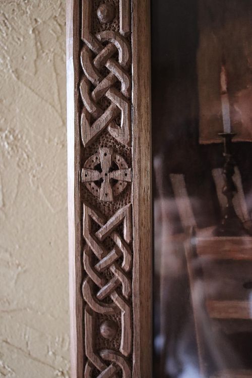 a close up photo of the other cross and knotwork on the frame