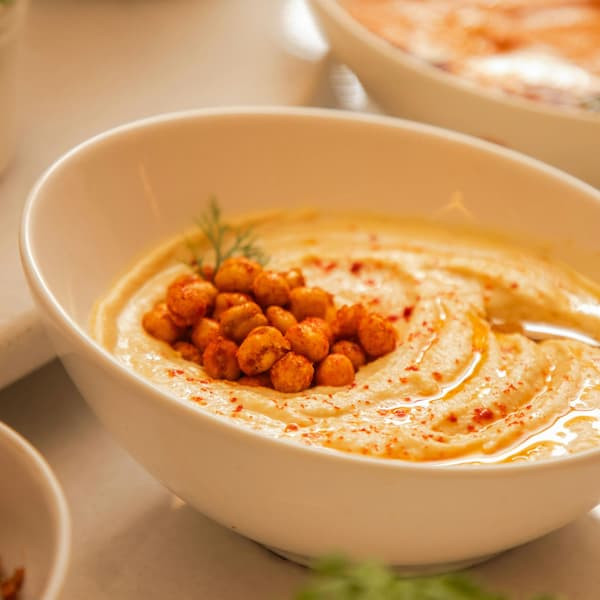 bowl of hummus with roasted chick peas