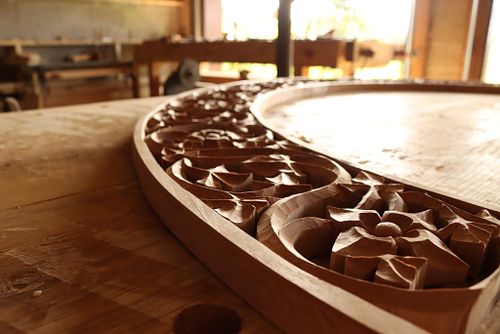detail of flowers and vines carved in alder for the tabernacle arch