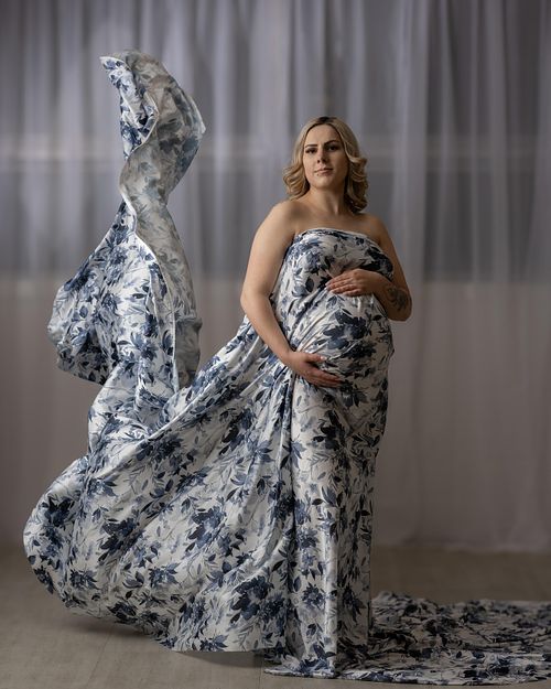 Fabric toss portrait of expecting mother in Prince Albert, SK.