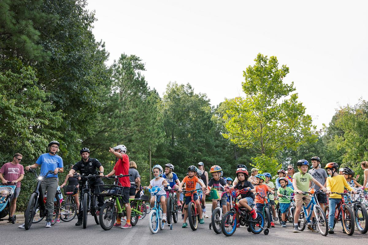 Kids staged on bikes for a bike parade at Scroggs Elementary School in Chapel Hill, NC