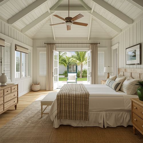 High-end real estate photography of a bright master bedroom with vaulted ceilings, coastal decor, and garden view by PrimePropertyPhoto.