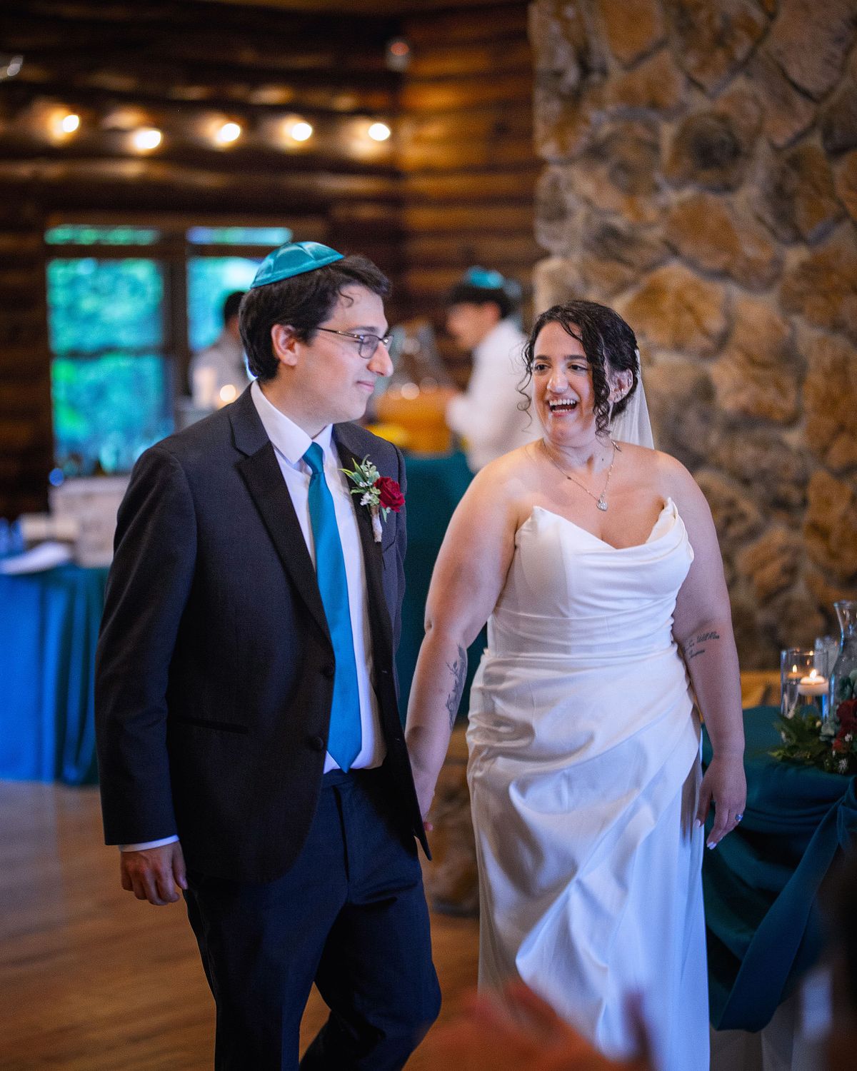 natural light wedding reception couples introduction, the couple smiling as the enter the hall