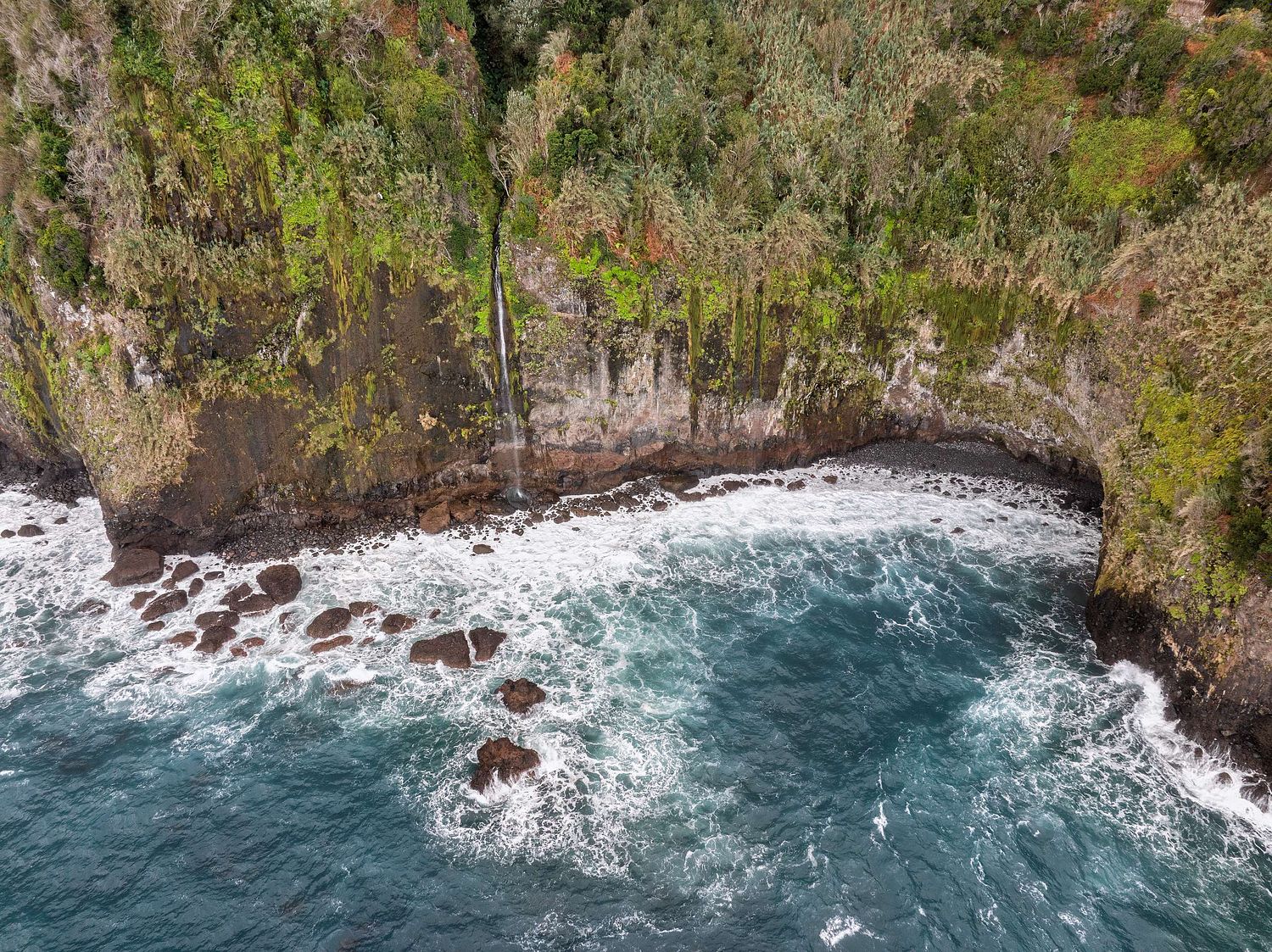Coastal waterfall and bay