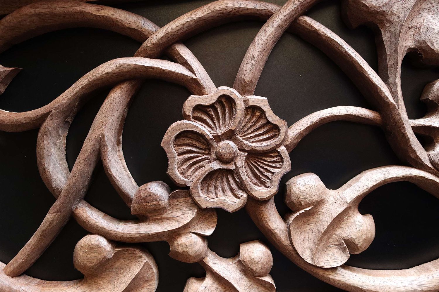 Hollyhock flower carved by hand in walnut for St. Joseph Shrine in St Bernadette Catholic Church in Lancaster, Ohio