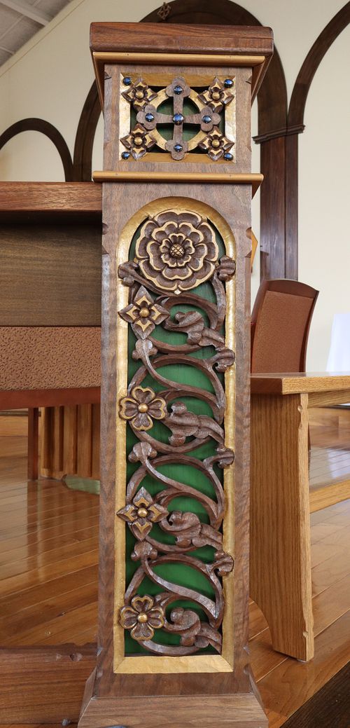 wood carving of vines and flowers on a post for a communion rail or altar rail for St. Bernadette Catholic Church in Lancaster, Ohio