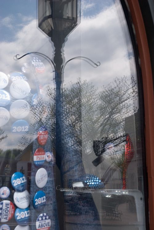 Women’s shoe and election pins from the 2012 presidential campaign on an American Main Street in WInchester
