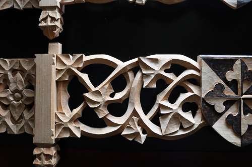 detail of the scrolling vines on the shelf carvings before stain in good light