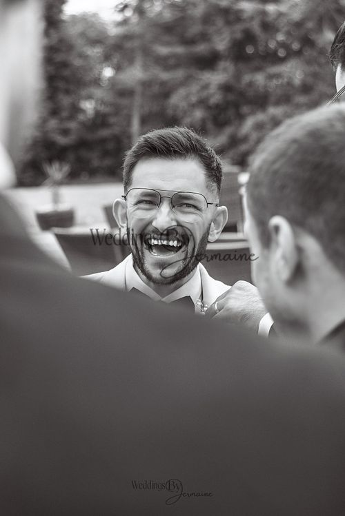 Wedding by Jermaine – groom laughing joyfully during the wedding celebration