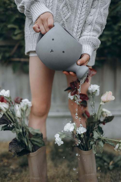 Handcrafted garden product held outdoors among plants