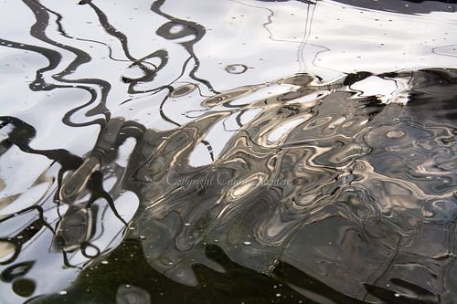 Contemporary color photograph of soft gray reflections, enhancing decor with understated elegance and capturing fluid motion, presented authentically by the artist with minimal post-processing.