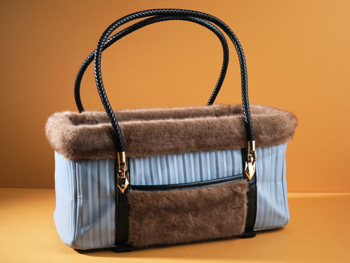 KibbleTime pet carrier on a mustard colored background