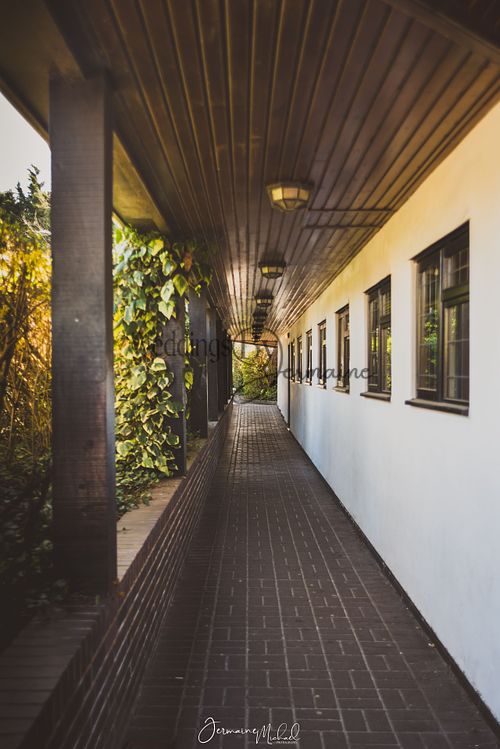 Sidewalk at Sketchley Grange Hotel and Spa, captured by Weddings by Jermaine, showcasing the elegant venue grounds and peaceful atmosphere