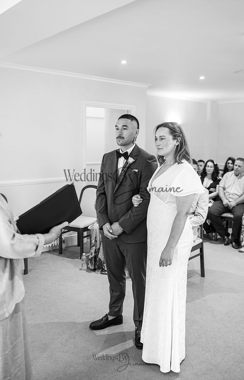 Bride-and-groom-listening-to-officiant-at-Oakham-Registry-Office