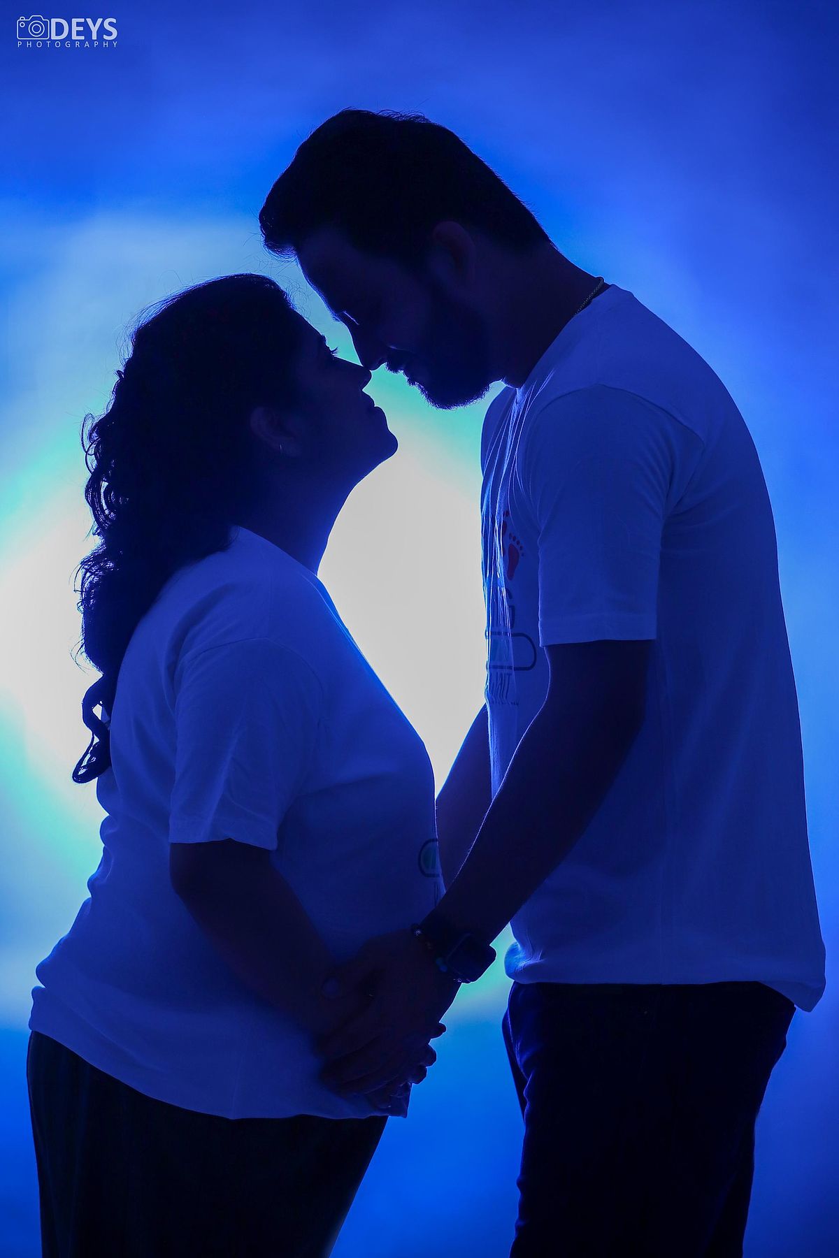 Silhouette couple pregnancy shoot near me