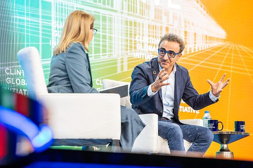 Chobani CEO Hamdi Ulukaya and journalist Katie Couric speaking at Clinton Global Initiative 2024 Annual Meeting in Philadelphia, panel on leadership and equity, captured by professional event photographer.