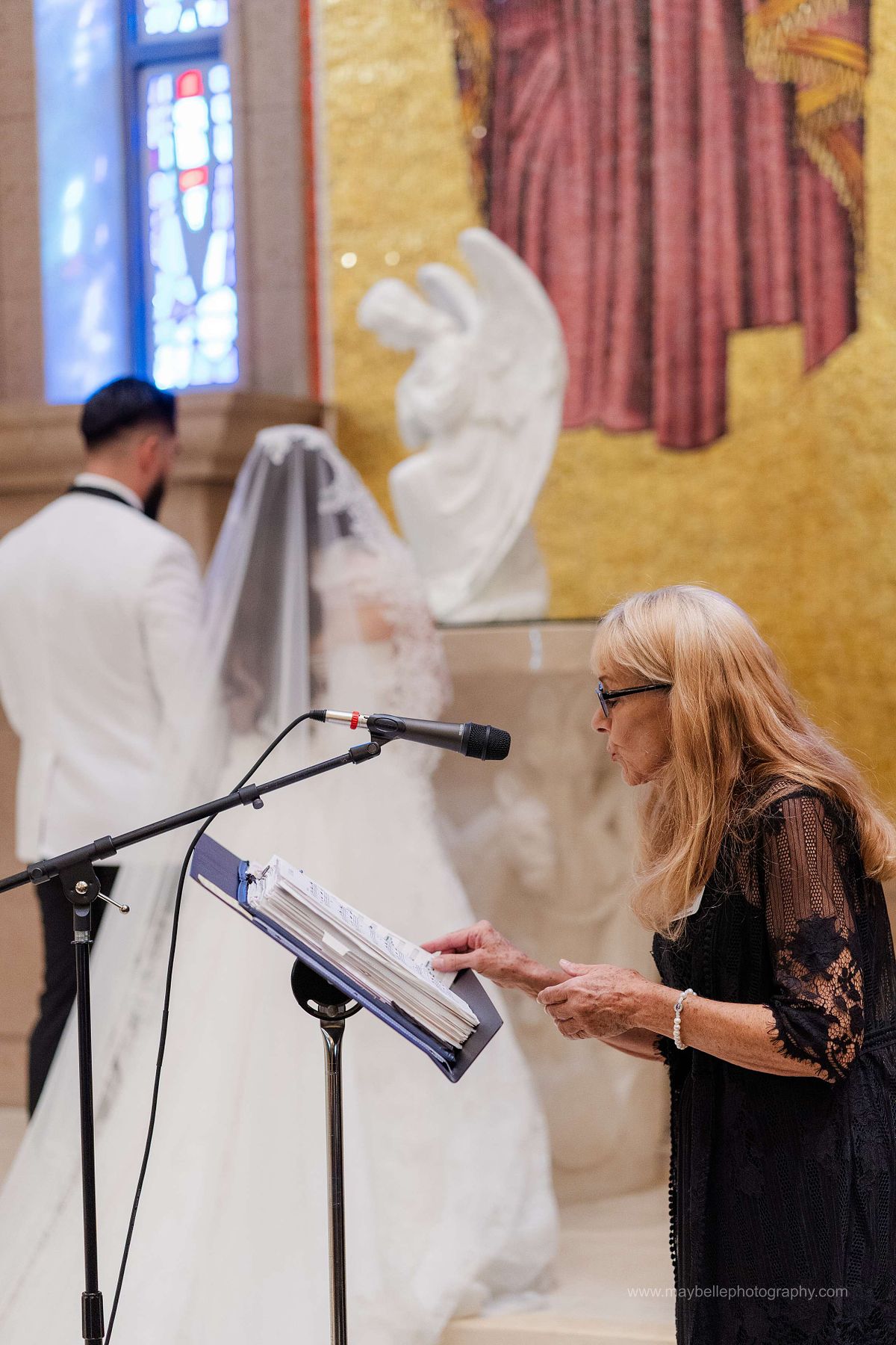 Exchanging vows at Saint Joseph, Husband of Mary Roman Catholic Church in Las Vegas Wedding Photography