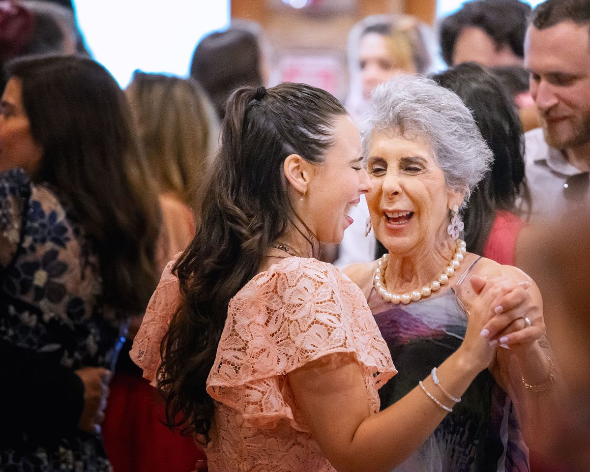 natural light documenting wedding guest dancing during reception