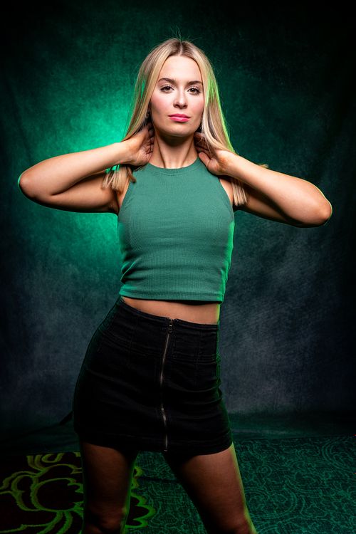 High school senior posing outdoors with natural light.