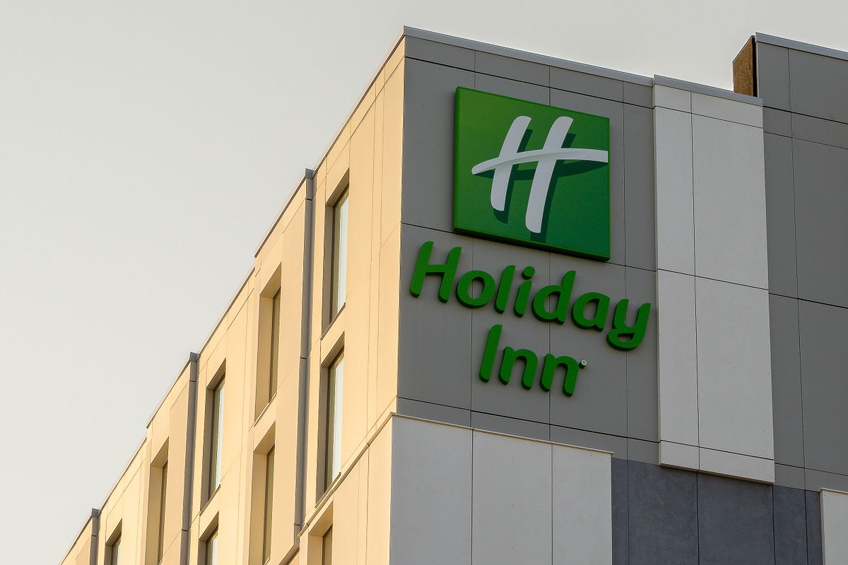 Close-up of the Holiday Inn exterior signage at the Dublin Airport location, showcasing the modern facade and architectural details. Architectural photography.