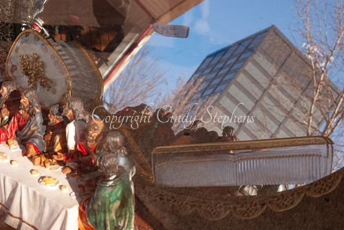 Last Supper iconography reflected in a store display, capturing the essence of small-town America