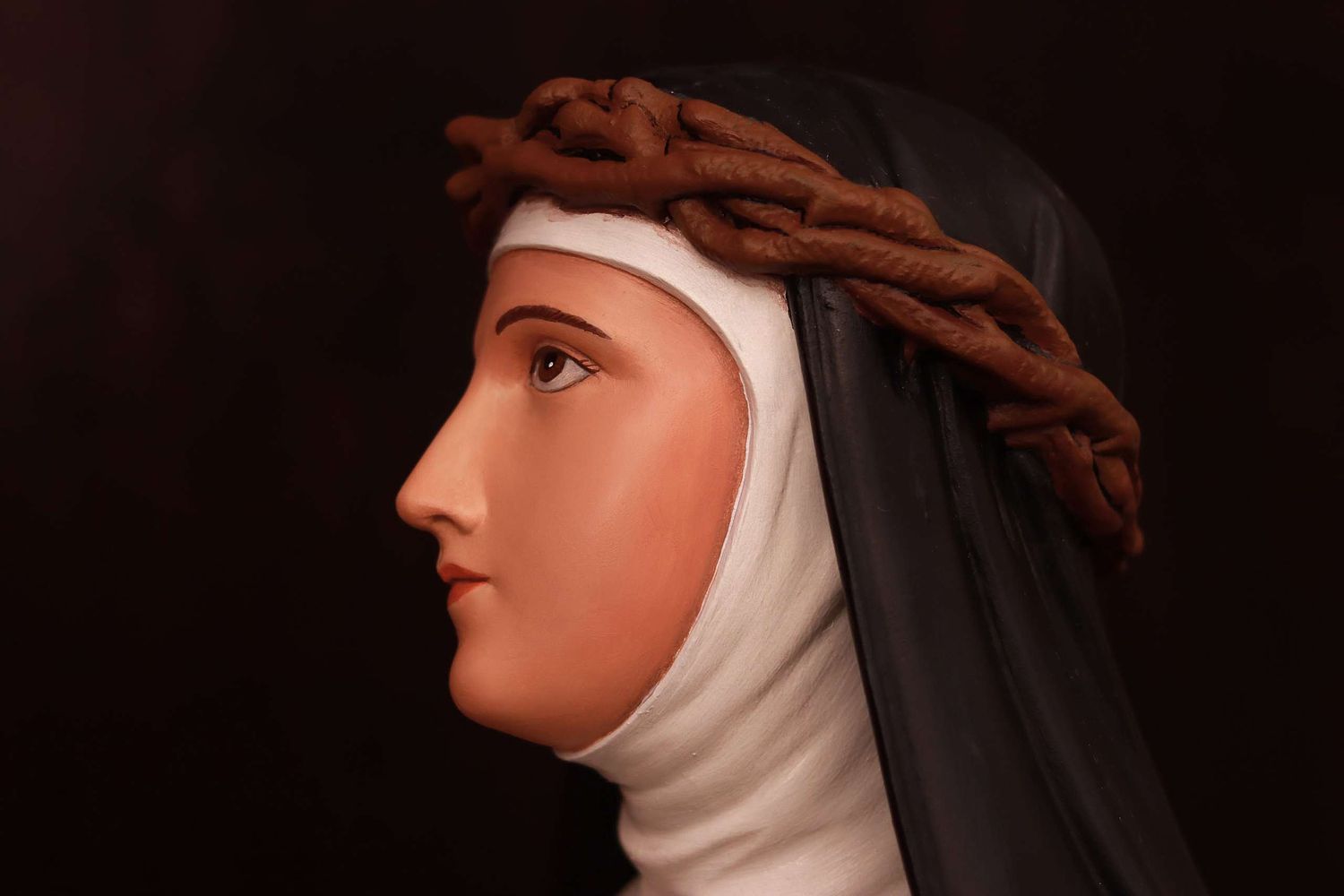 Saint Catherine Statue after repainting and restoration by Contrasts Woodcarving