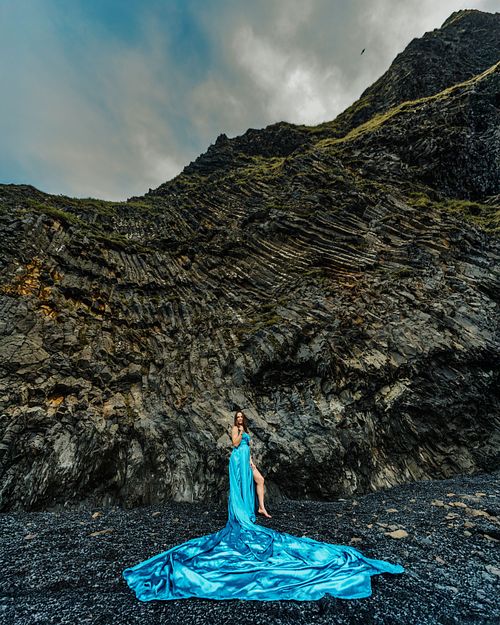 Long train dress photoshoot in black sand beach, Iceland