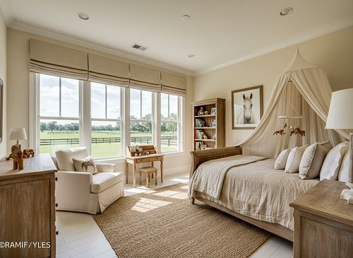 Airy master bedroom interior with a canopy bed, natural lighting, and plush carpeting for a Gainesville real estate listing by PrimePropertyPhoto.