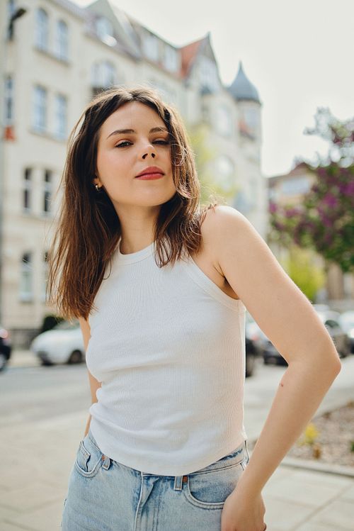 Outdoor portrait in Poznań with natural light, capturing relaxed and authentic expression