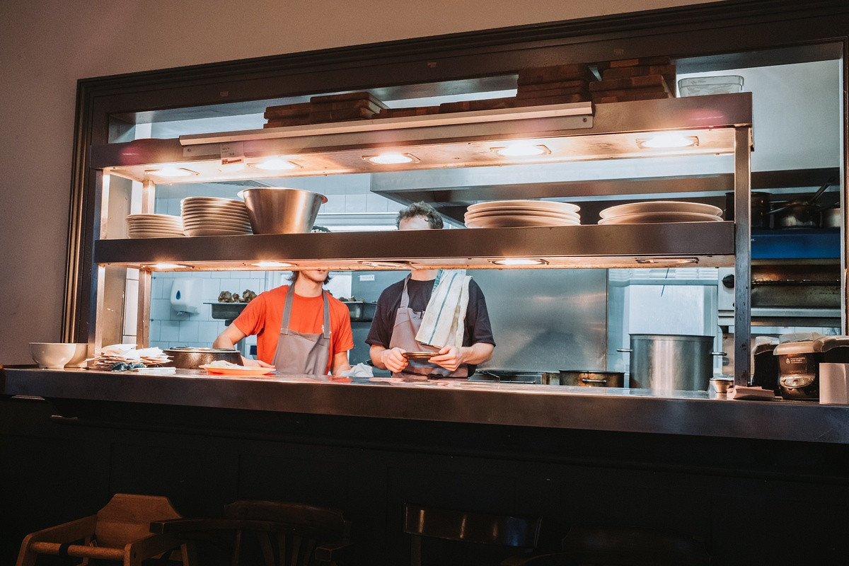 Kitchen staff cooking in pub in London
