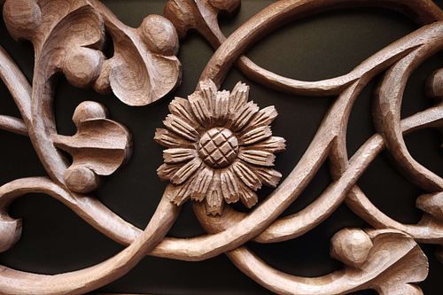Goatsbeard flower carved by hand in walnut by Wes Baker for a door for a St. Joseph Shrine