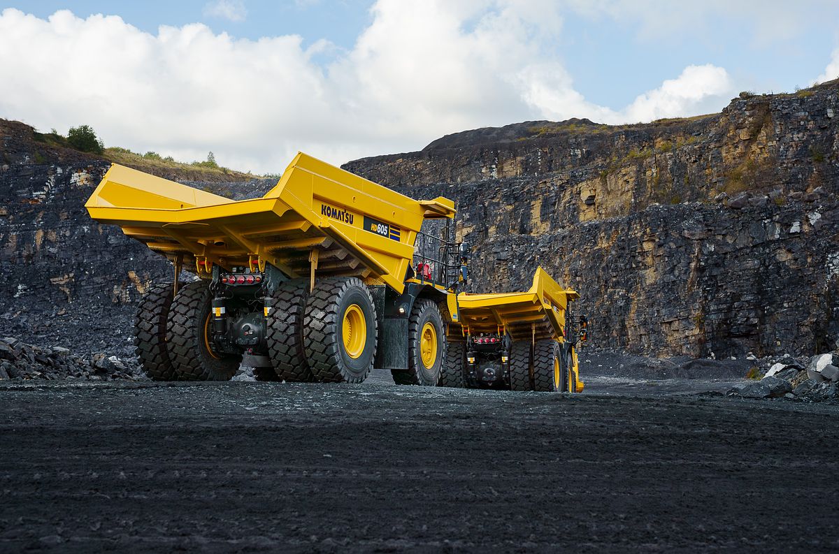 Komatsu HD605 Dump Trucks Descending into Quarry
