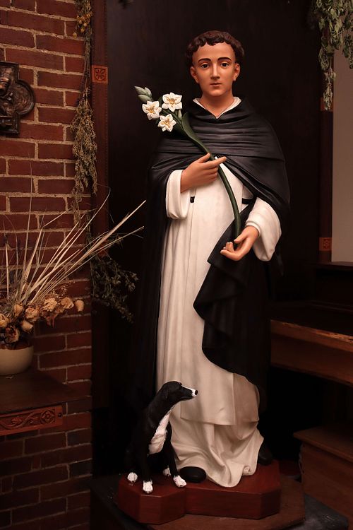 The same statue of St. Dominic beautifully restored, with a new dog and hand-carved lilies for Holy Trinity Catholic Church in Somerset, Ohio.